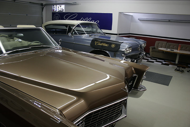 Cadillacs in garage